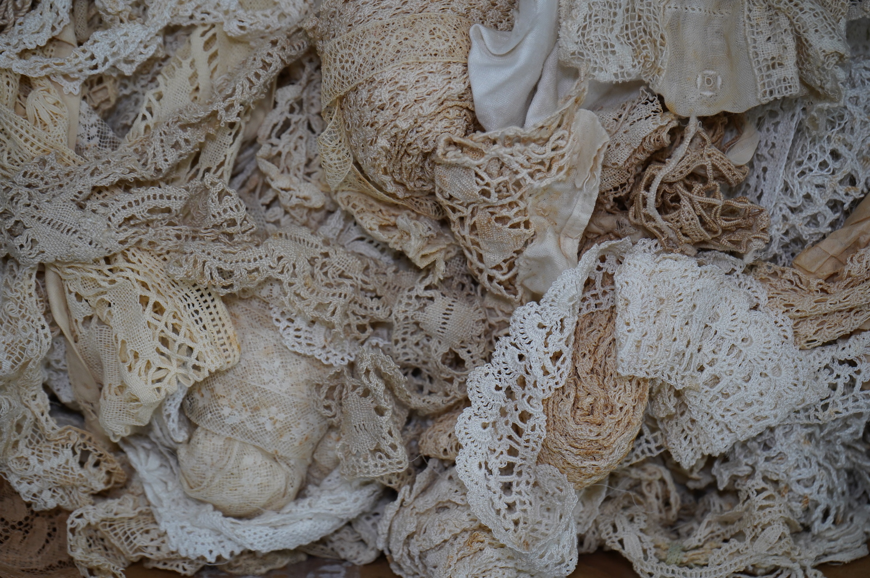 A large collection of mostly handmade 19th and 20th century lace trimmings. Condition - poor to fair to good